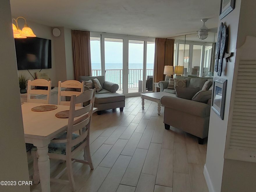 Dunes of Panama E903 - Absolutely stunning gulf front Deluxe 2 bedroom, 2 bath condo.  Beautifully remodeled and updated in 2022 and would make a perfect vacation rental or second home.  Ceramic tiled wood grain floors throughout, textured ceilings, stainless steel appliances, tiled master shower, blackout curtains.  This gorgeous condo is a must see!  The Dunes of Panama Resort has 1,500 linear feet of sugar white sand, 3 gulf front pools (one heated), tennis courts, basketball, free Wi-Fi, fitness room, volleyball, shuffleboard, outdoor BBQ grills, Stingray's Restaurant and gift shop and the Sneaky Tiki poolside.