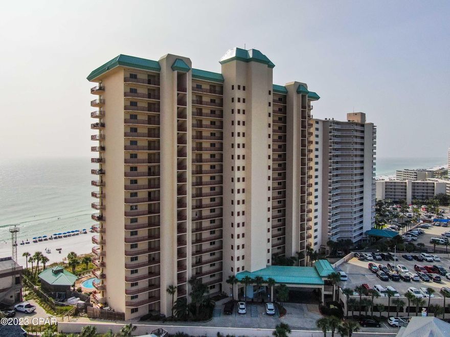CURRENTLY UNDER CONTRACT!  SELLER WILL CONSIDER BACKUP OFFERS.  Nestled amidst the pristine sands and turquoise waters of Panama City Beach in Hidden Dunes is this beautiful corner unit three bedroom, three bath condominium which offers an unparalleled beachfront living experience combining breathtaking views and the epitome of coastal luxury.

Upon entering the condo, you're welcomed by a spacious foyer and, open-concept living and dining area tiled throughout.  The large windows and sliding doors offer panoramic views of the Gulf of Mexico allowing natural light and access to a 456 sq ft. balcony.   

The living area offers a plush sectional sofa with large screen tv  and the opposite side  with a new leather sofa bed, loveseat and recliner.  Tasteful artwork and carefully selected decorative coastal theme pieces create an atmosphere of comfort.

The kitchen is a chef's dream, equipped with stainless steel appliances, granite countertops, mosaic tile backsplash, breakfast bar and ample cabinet space.    A stylish dining area adjacent to the kitchen provides plenty of room for a large group.

The master suite comes with a king sized bed and in suite bathroom with a garden tub and separate shower.  It also comes with it's own private balcony. 

This unit comes with it's own dedicated parking space in a covered garage and an exterior storage space across from the front door.  Also a ring door bell camera was installed by the owner.

Presently on a vacation rental program thru Real Joy, the owners have enjoyed a strong rental revenue and use as a second home.

Make an appointment to view this beautiful property and amenities offered at Hidden Dunes!