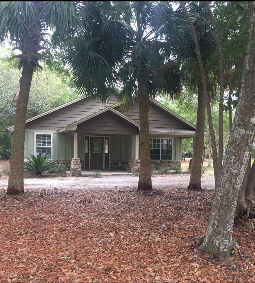 MOTIVATED SELLER!!! Located in the highly desired St. Andrews and just over 5 minutes to Panama City Beach. This immaculate craftsman style home offers 3 bedrooms and 2 bathrooms with an OPEN FLOOR PLAN!! The large master bedroom includes a huge walk in closet & master bathroom with a double vanity. Features brand new wood flooring throughout with carpeted bedrooms. Many outstanding upgrades such as the fireplace, custom wood cabinets, solid surface countertops, pantry, skylights, and a large laundry room. The exterior features both covered front and back porch, security lights, double paned windows, in-ground sprinkler, -30 year dimmensional shingles- and a double garage access through back alley way!! Additional lot next to the property is available.