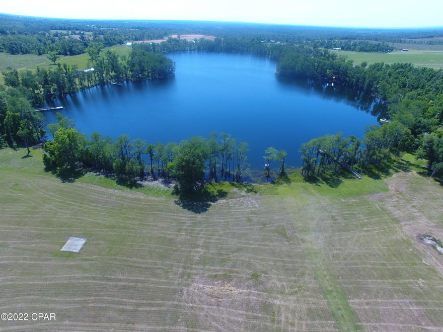 If you're looking for a secluded spot in the country to build your dream home, look no further! Located on an approximately 30 acre private lake in rural Jackson County, this lot is the ideal location to settle and relax while still being with a 20 minute drive to Marianna and only 10 minutes from an I-10 exit. Current survey and blueprints for a custom home will also be included to make this an almost turn-key site for your future home! Don't miss your opportunity at this wonderful investment, schedule a showing today!