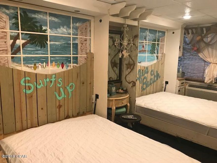 ONE OF A KIND UNIT.  You must see this unit to appreciate the art work and amenities in this unit.  Features a living area with 2 Murphy beds, that also doubles as a theater screen  with a projector that is connected to Netflix. and high quality electric leather theater seats. Also has a big screen TV, Soround Sound, LED lights over head boads,when let down.  2 Hollywood type chairs to watch TV. equipped with a faux fireplace to add to the mood of the room. The kitchen has a stove with a steam cleaning oven and a microwave/oven that serves as both microwave and broiling. Refrigerator with ice maker.  A bowl type lavoratory.  A bar with bar stools. A make up table and chair.  In the living area is another table with chandelier.  This unit is a must see.  Made for pure comfort and relaxation