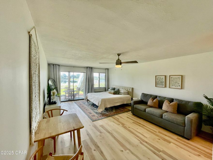 COMPLETELY RENOVATED BEACH CONDO!!!!! This First floor lakefront condo is located right across the street from the Gulf of Mexico on the popular West End of Panama City Beach! This studio beach condo offers brand new white shaker soft close cabinets, quarts countertops, tile backsplash, luxury vinyl plank flooring, floor to ceiling tile shower with heavy glass door and much more.The property has been renovated top to bottom including new AC unit and Water heater. This Lullwater condominium is perfect for a vacation rental, second home or Primary residence. Sit on your private back patio and watch breathtaking sunsets over the lake, or enjoy a dip in the community pool! Owners have ample parking, a lakefront community pool, bbq grills, and the world's most beautiful beaches are only a 2 minute walk away! This property comes completely furnished! Turn key, ready to start renting immediately or just bring your cloths and move right in.