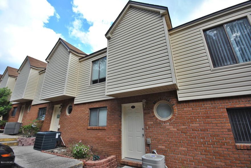 YOU CAN OWN THIS CONDOMINIUM FOR LESS THAN RENTING! This condominium is located in the secluded Landings at Lake Caroline, a small community with a swimming pool.  Open floor plan with 1/2 bath downstairs, the Master Bedroom has a large walk-in closet and balcony.  This community is located in the  desirable St. Andrews area of Panama City, conveniently located to shopping, hospitals and only 25 minutes to Panama City Beach... Come visit today!