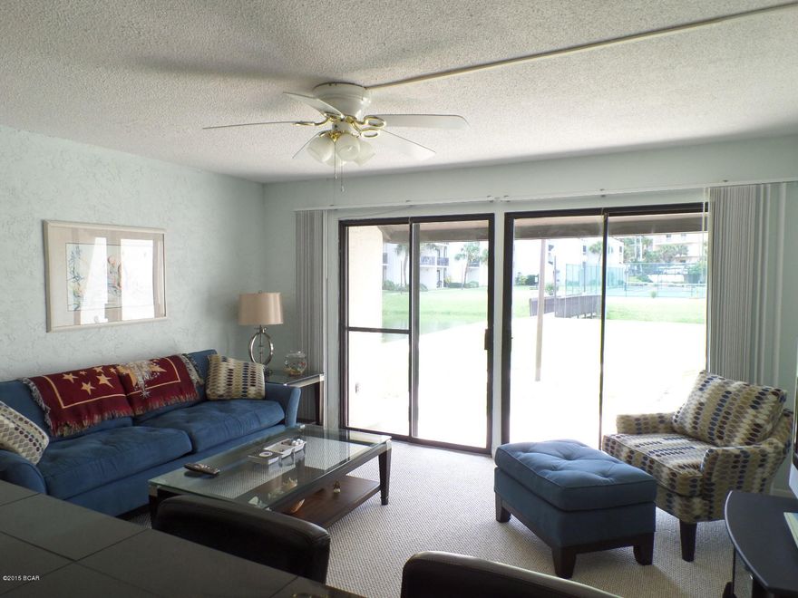 This condo has upgraded kitchen & baths, new carpet, newer furnishings, delightful décor and park right at your front door. No waiting on elevators and ... Sugar Beach condos are beachside-no crossing Thomas Drive to get to the sugar white sands. You can relax here and sit our on your patio overlooking the freshwater pond, where you can feed the ducks and Koi fish or stroll along the walking path towards the Beach and enjoy the beautifully landscaped and lush courtyard. The Sugar Beach property is a low-rise, low-density property that features tennis courts, a swimming pool, grilling area and a wonderful clubhouse. HOA fees are low at $1,056 per quarter.All information is believed to be accurate and correct; buyer to confirm & verify if important.