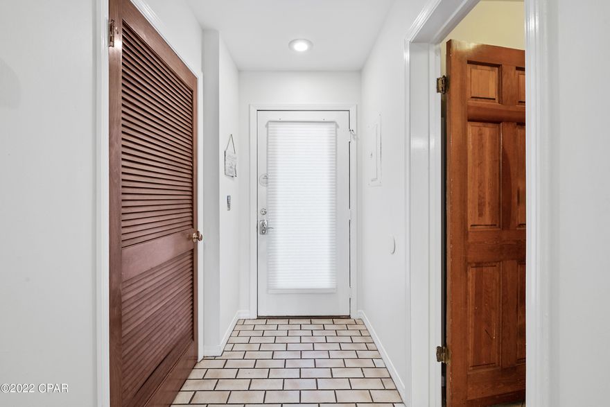 Come see this first floor unit at the Villas at St. Thomas.  This priceless end unit is a 2 bedroom with 2 baths is one of a few units with over 1500 sq/ft no stairs and being sold fully furnished.  This Villa unit has an amazing view of the lagoon with a newly installed color-changing Fountain. You can relax in the living room or on the patio with your favorite beverage while watching the light show on the lagoon.  This is one of only 3 units that are the largest sq. ft. in the complex. Come enjoy this spacious 1 story unit with no stairs or elevators - easy access.  The primary bedroom is spacious, overlooks the water, and offers a small office.  The secondary bedroom is large enough for a full bed and 2 bunks which are perfect for extra family or renters. 2 bunks which are perfect for extra family or renters.
 This home is ideal for an investment property, or as a primary or secondary home.  The choice is yours!!!  
St. Thomas Square is a popular complex that many enjoy. The complex features a great swimming pool, tennis courts, and a gate for added security in addition to boat access, slips, and storage.  The property grounds are beautifully maintained and have tables and grills.  Don't feel like cooking, then head over to Guadalajara Mexican restaurant or the other many restaurants nearby.  Maybe enjoy a glass of wine at PCB Winery.  The kids will love the Emerald Falls Amusement Park with go-karts, goofy golf, and bumper boats; and, you don't even have to cross the street.  Ready to head to our famous white sand and emerald green waters on the Gulf of Mexico, then head out to the nearby beach access.