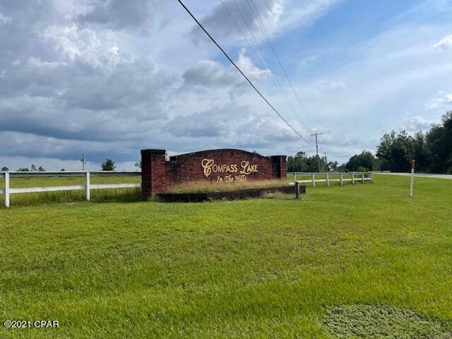 This one acre, corner lot on a paved road in beautiful Compass Lake in the hills is exactly what you've been looking for! Build your dream home in the peace and quiet of Jackson County, with just a short commute to the breath taking beaches of PCB. Lot is wooded and zoned flood zone X (high and dry)