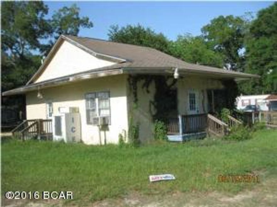 Commercial property located on US Highway 231 and Church St, containing a 1151 sq ft stucco over wood building, last used as a cafe or restaurant, presently vacant, equipped with tables, chairs, utinsels, dishes, pots and pans, counter, stove, cooler, refrigerator, cash register. It appears that everything needed to start a restaurant business is in place. Building has two rest rooms, his and hers, CHA plus a room AC, ample parking, on .327 acres. Lots of traffic on US 231 and US 90 just two blocks away.