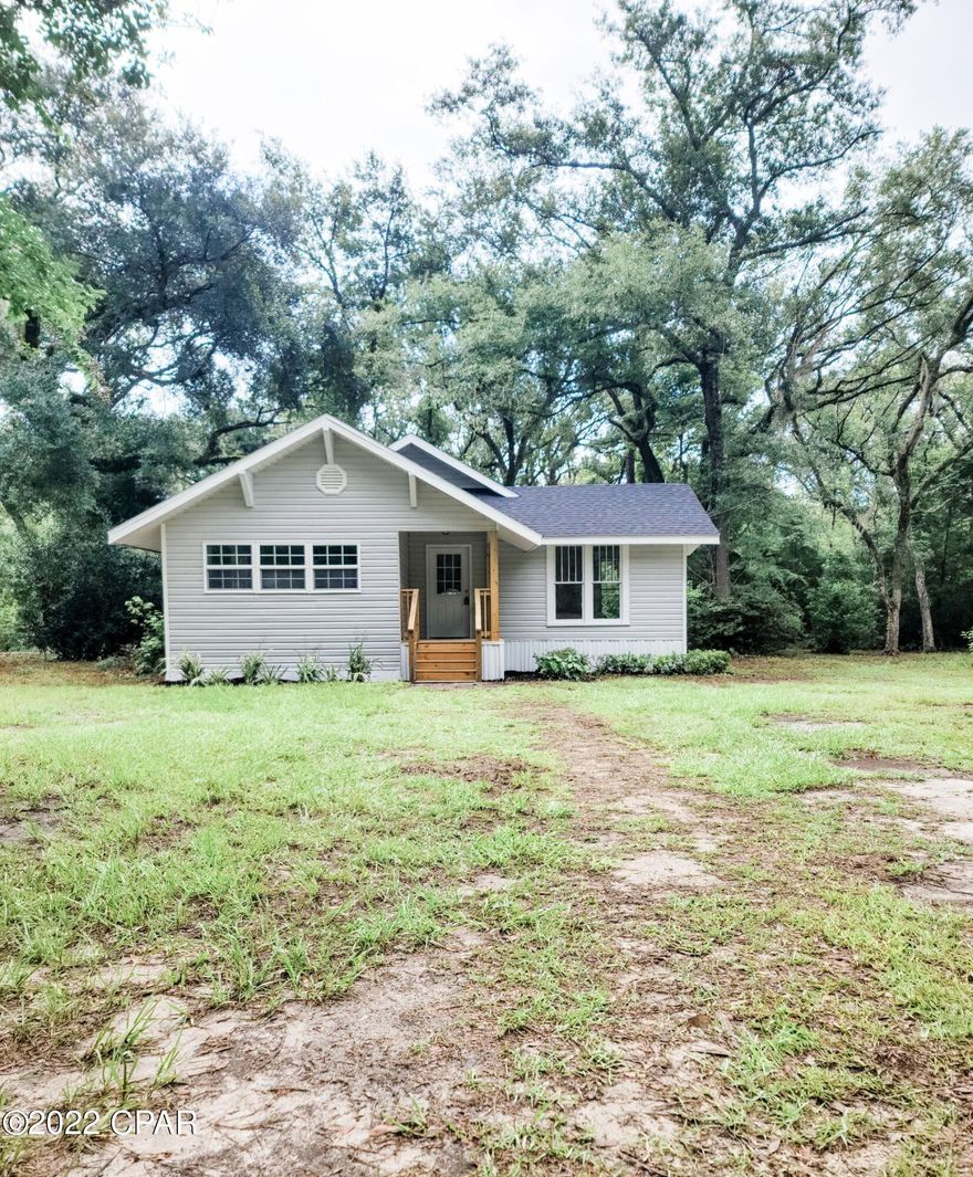 This beautiful and newly remodeled 1760 square foot home rests on 2.35 acres in Marianna, Florida. Complete with 3 bedrooms and 2 full baths, this house is move-in ready!  This home boasts new Frigidaire appliances, gorgeous quartz countertops, cultured marble vanities in the bathrooms and luxury vinyl planks and tiles in throughout the home. This house is ready for your family to pen the next chapter in your lives.  Call your favorite real estate agent today to set up a showing!