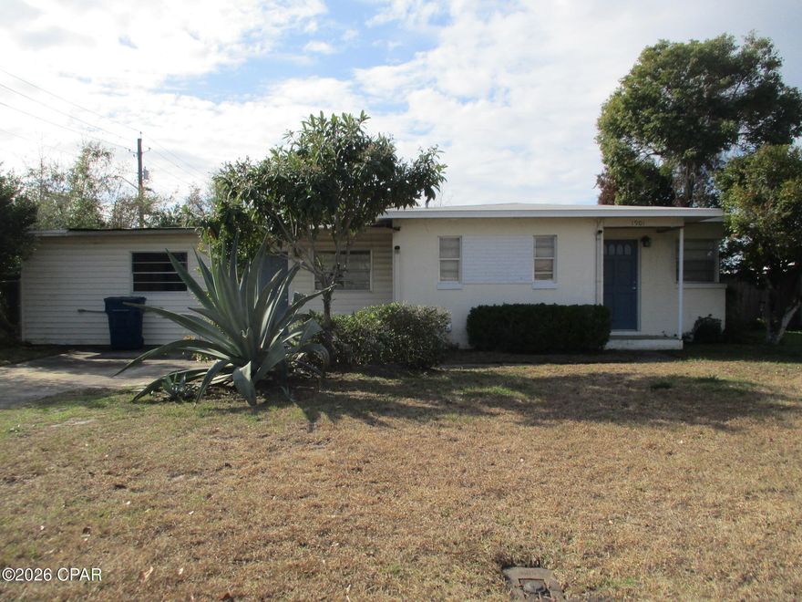 Large cozy 3br/1 ba ranch style block home on 1/4 acre corner lot in Panama City! Lots of room inside and out with 3 large living areas inside and a huge fenced back yard outside. Home is centrally located, close to schools, shopping, a lovely park and playground almost next door, and is also not too far from the most beautiful beaches in the world!
With lots of room, home is solid and has lots of upgrade potential for the kitchen and the living areas. Seller will consider a flooring allowance as well. There is a large workshop and shed in the back yard, both with electric service, and accessible through gates from 19th St. Great place for pets. Priced to sell!