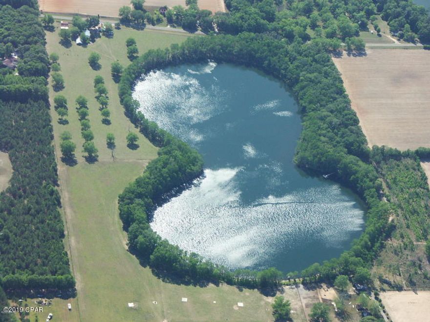 WATERFRONT lot on the beautiful Strickland Lake.    Nice flat, lots with road and water frontage ready for you to build your dream home.   Underground utilities already provided.    Lot sits in a way where you can fully enjoy the sunsets.    Located only a few miles from Interstate 10 between Marianna and Grand Ridge south of the interstate.  Owner/Broker Call today to see for yourself!!