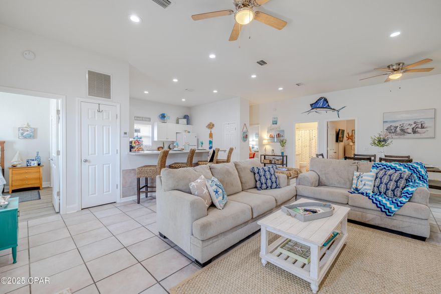 CURRENTLY UNDER CONTRACT, SELLER WILL CONSIDER BACKUP OFFERS''Location, Location Location! Are you looking for a Beautiful 3 bedroom 2 bath Beach home near local pubs & restaurants, Public boat ramp, lagoon & white sandy beachs with NO HOA in a golf cart friendly neighborhood ? if so this is the one! This roomy beach house has a wonderful large  great room with  cathedral ceiling  for wonderful entertainment space and or great  family time . There is a sliding door off the dining space for access to covered patio/storage area as well. Back inside the roomy kitchen has a expansive breakfast bar with loads of counter space and seating for 4 or more. The natural light beams in from all the windows especially in the three bedrooms which all have spacious closets as well. There is a laundry room off the main living area. This great home features a cozy covered front porch and maintenance free front yard with tons of parking ! HVAC newly installed in 2024 and a Metal Roof complete this beautiful beach home! This home comes fully furnished as well!  Call your Favorite Realtor to check this beauty out today!