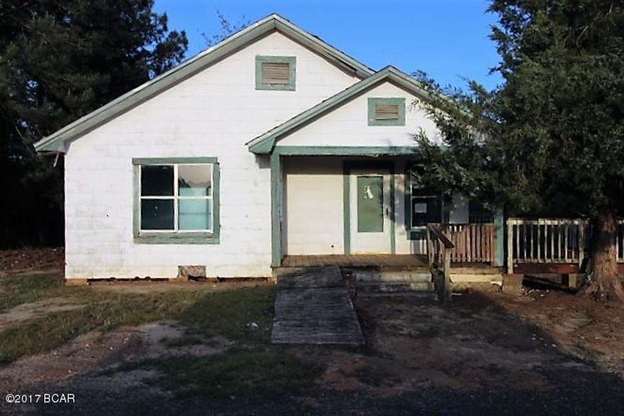 This property consists of two structures on 9.4 acres of land.  The value is in the land as the houses have little value.  The land is very nicely wooded and is highway frontage. There are two wells on the property, condition unknown.  This is good investment property. The location is convenient to town and near the Ponce De Leon school.