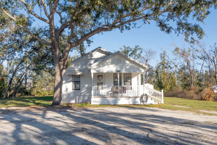 CURRENTLY UNDER CONTRACT, SELLER ACCEPTING BACKUP OFFERS Welcome to this adorable home situated on a huge lot with room for all your toys! Don't let the age fool you because this homes effective date built is 1996. Very well maintained and at an affordable price. As you walk in you'll immediately notice the spacious living room and dining area. The kitchen boasts new stainless steel appliances, newly painted cabinets and new counter tops. The bathroom is remodeled and includes a new vanity, new floors, and new commode. The family room is very large would be great for family movie nights. Need extra inside storage? This home has great storage potential! Enjoy  entertaining on the 12x25 back yard deck  or a bon fire around the fire pit. Septic is only a few years old and water heater replace