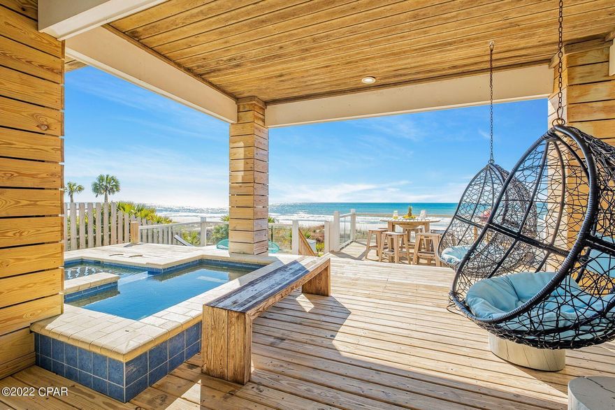 CURRENTLY UNDER CONTRACT, SELLER ACCEPTING BACKUP OFFERS. Few beach houses can outshine this amazing gulf-front home on Panama City Beach. Three stories of bright living space include two magnificent gulf-front master suites with balcony access, a fitted bunk room for four, a games room and covered terraces on every level. The ground floor includes a garage and huge wooden deck for enjoying uninterrupted views of the white sand and sparkling gulf waters. It's a place for sunbathing, alfresco dining, entertaining and sharing quality time together. Wooden steps provide access to the sand for tranquil morning walks with the pelicans, swimming and shelling. Return and cool off with a dip in the private heated pool and spa before snoozing in the swing chair. The property is eloquently designed with a series of features that reinforce the unspoiled beachfront location. Wood accent walls, beamed ceilings, custom tiled showers and deep soaker tubs provide a sense of luxury with a laid-back ambiance. The Arctic white kitchen combines modern elegance with practicality with a full range of stainless steel appliances. The wood-effect floor tiles flow through the spacious sitting area to a wall of windows. Sliding doors, provide access to the shady porch and stunning views of blue gulf waters to the horizon. There's ample space for dining beneath the coffered ceiling with feature lighting or gather around the lengthy granite breakfast bar to share a feast of seafood, hors d'oevres, sparkling wine and cocktails. The second kitchenette is well equipped for preparing snacks, drinks and fruit platters. It opens onto a hangout spot and games room with a billiard table and foosball. Deep, cushioned armchairs invite you to chill out with a beer and good friends. This breathtaking residence is for sale turnkey as a lucrative investment with high rental potential. Life's a beach, as they say.