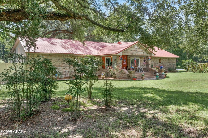 Dreaming of space and serenity? Your perfect oasis just hit the market!!!!

This beautiful country 3BR/BA home with lots to offer and lots of updates.
Dont let the age fool you.

It includes 36 acres with manicured front and back yards. It truly has the look of a park setting.
With an extra-large front porch that's perfect to sip on your coffee and watch the cars go by while rocking your day away and a relaxing covered back porch overlooking a gorgeous back yard for hours of entertainment and enjoyment while grilling your favorite meal.
As you walk through the front door you will find an oversized living room with a dining area overlooking the front yard.
Each bedroom is a nice size with adequate closet space for your wardrobe
The extra big den is located on the back of the home connecting with the back porch for easy access. 
One bathroom offers an abundance of cabinets, shower, utility sink and a pretty vanity with an access door to the back porch. 
The master bedroom is split from the rest of the home and has a bathroom with a double vanity, and a tub you can soak in while relaxing after a long day's work and lots of extra cabinets for storage of towels, toiletries, etc. It also has its own outside door for your convenience. 
Now let's talk about the unique kitchen!!!!! 
There are so many features as you can see in the pictures but even they don't do it justice. 
It includes a breakfast area that overlooks the back yard, beautiful built in cabinets that keep going and going, an island bar with a sink, dishwasher and bar stools area for extra places to eat and chat while preparing any meal, with a nook for cookbooks, nice appliances, a built in desk , an oversized pantry, 2 refrigerators, with an extra one on site,  a freezer, a convenient nook for the washer and dryer, and a door that goes to the side yard. 

Lots of new windows to enjoy everything the outside has to offer while staying cool or warm inside. 
The 976 sq ft garage is also full of storage cabinets and has plenty of room to park several vehicles and an atv. 

Now let's ponder on the outside. 
There is a 1150 square foot workshop with the electrical provisions in place that serves as an area for a tractor, lawn mower and work areas that can meet many needs. 
With proper permitting etc it could possibly be a mother in law suite. 
The well house serves as a well tank cover and garden utensils storage area. 
There is chain link fencing for dogs/animals. 
Now for the acreage. 
There are two ponds, lots of beautiful trees located in different areas, cleared pastureland, and lots of highway frontage. 
You have to see this property to get a clear picture of the beauty it offers!!!!!