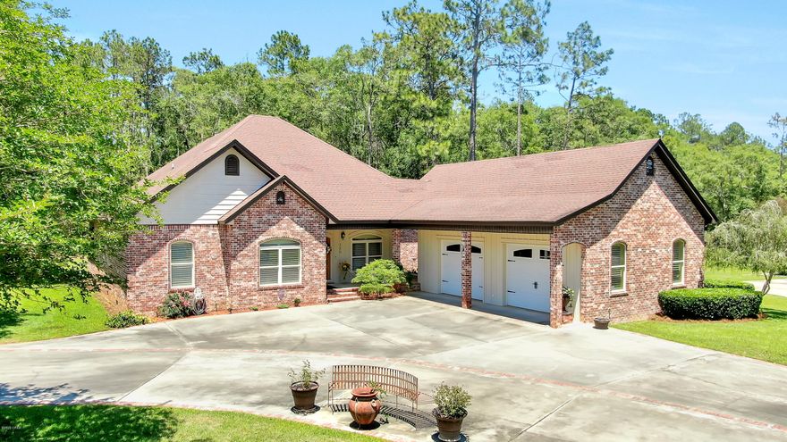 'CURRENTLY UNDER CONTRACT, SELLER ACCEPTING BACKUP OFFERS' Corner Lot Beauty! This Immaculate 4 Bedroom 3 Bath Home, with its large covered wraparound porch, sits on nearly 2/3 of an acre in the city limits of Bonifay. This sprawling home has features beyond allowable print. PLEASE view the Home Highlights List in the Documents Feature of the Listing. You will be impressed! The master suite features tray ceilings in the bedroom, and a beautiful bathroom with a large walk-in shower, double vanity, a large walk-in closet, and a deep jetted tub with hidden T.V. in custom cabinetry. Off the living room, the back screened in porch is surely a place you will want to spend your day relaxing, or watching a game on the T.V. Outside, off the attached side porch, is the 4th Bedroom/separate living quarters with full bath that overlooks the floral garden and fountain. The home also features a massive 2 1/2 car garage that is equipped with a large sink plumbed with hot and cold water, and has pull down ladder access to over 500 sq. ft. of overhead storage. The home even has a whole home, automatic LP generator! There are so many little details to this home, and you have to see it in person to fully appreciate it! Schedule your showing today!