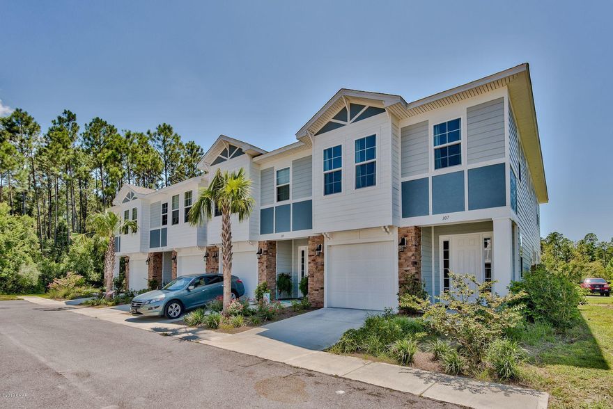 Practically brand new townhome in Waterfall just east of Pier Park with a community pool! This home offers 10' ceilings on the main level and 9' ceilings on the second level. Modern colors in the kitchen cabinets, granite and weathered barnwood luxury vinyl plant flooring will lend themselves to so many designs and styles -- make this space your own! There is a large single car garage with plenty of parking and storage space too. Located behind this end unit townhome, is a spacious patio with room to add a small fence or extend the deck. The master and both guest rooms are located on the second floor. All extremely spacious with high end finishes! This master suite is one you'll have to see to believe! Call us today to schedule your private showing!