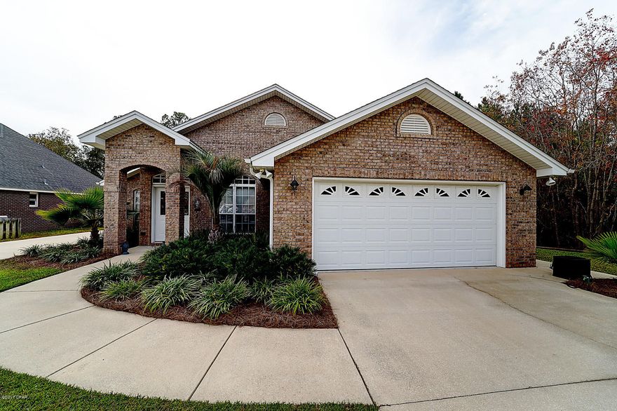 MUST SEE CUSTOM HOME!!!! All brick, fully custom, fully upgraded home. *Boater/RV* owner ready.  Double driveway access.  Boat/RV pad with electric and water hookup and outdoor fish cleaning area fully equipped.  Custom lighting in house on multi level dimmer switches.  Laundry room equipped with dog washing station. Private wooded lot behind and adjacent that will never be built on!  Bathroom wired with phone line service. 220 hot tub power run to back.  Hardwired surround sound on back screened patio. Vaulted ceilings throughout with solar sky light in kitchen.  Electric supply in kitchen island.  Beautiful hard wood floors in main living area, electric fireplace, and custom fit TV above fireplace to come with home. Will not last long in such a great location.  Come and see today!!