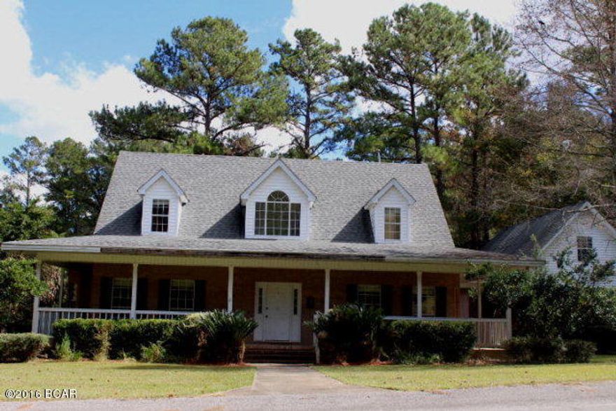 PRICE REDUCTION!! Large home in town in great location for easy access to all local amenities. Only a short distance to Chipola College and medical facilities. The home is two story with the master bedroom and bath downstairs and the other 2 bedrooms and bath upstairs. The living room has cathedral ceiling and beautiful hardwood floors. There is a large kitchen with a breakfast nook nearby. There is a lovely formal dining room. There is also a den and half bath downstairs. An open deck looks over the back yard. There is also a 2 car attached carport with an attached apartment with half bath.