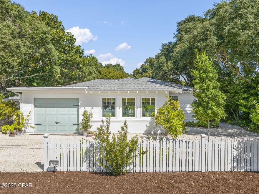 Charming Coastal Cottage just one block from the beach! Completely renovated inside and out, this home offers a new roof with waterproof membrane and hurricane clips, LP SmartSide siding, new impact doors and windows, and an energy-efficient HVAC system, plus fresh interior and exterior paint. Designed by a professional interior designer, it features antique French barn doors, decorative finished concrete floors, and a master suite with a deep soaking tub and private sitting room. Added protection includes hurricane fabric, and all of these upgrades provide a huge insurance discount, currently only $2,400 per year. Sold furnished, the home is turnkey. Landscaped grounds with well water sprinklers lead to a secret garden oasis just steps from the Gulf. In a community that does not allow short-term rentals, you'll enjoy a quiet, peaceful lifestyle.