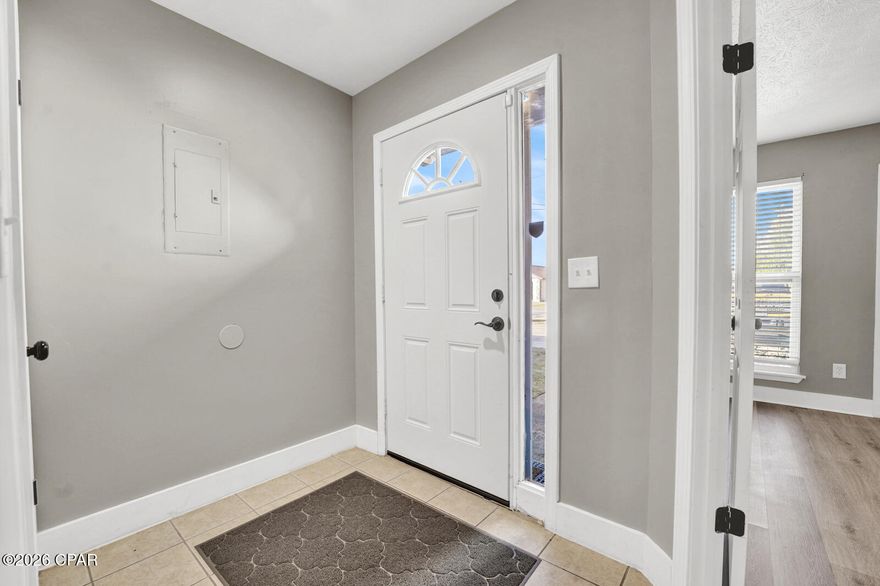 Welcome to this beautifully updated patio townhome in the charming Hickory Park community. This inviting home features durable vinyl plank flooring throughout the living area and bedrooms, creating a modern and cohesive feel.  The spacious primary bedroom and second bedroom are both conveniently located on the first floor. The primary suite includes a private vanity connected to the main bathroom, along with a laundry closet equipped with a full-size washer and dryer.  The updated kitchen showcases a pantry, stainless steel appliances, and a stylish tile mosaic backsplash. It opens seamlessly to the main living area, perfect for everyday living and entertaining. Two sliding glass doors provide abundant natural light and lead to the covered patio—ideal for relaxing or outdoor dining. Upstairs, a bonus loft offers additional flexible living space and includes two storage closets. This area can easily serve as a home office, exercise room, game room, or even a third bedroom. Just beyond the patio, enjoy access to a large courtyard and the community pool, adding to the appeal of this low-maintenance lifestyle.
This would make a great opportunity for a starter home or rental property investment!

This home is conveniently located within 10 minutes of Tyndall Air Force Base and close to shopping, schools, parks, restaurants, and much more! This townhome offers comfort, functionality, and an excellent location.