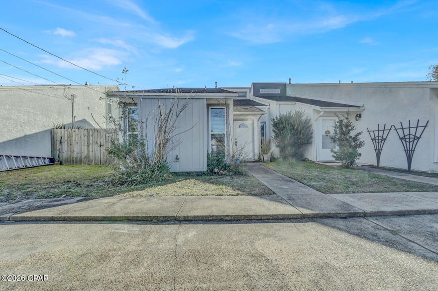 Welcome to this beautifully updated patio townhome in the charming Hickory Park community. This inviting home features durable vinyl plank flooring throughout the living area and bedrooms, creating a modern and cohesive feel.  The spacious primary bedroom and second bedroom are both conveniently located on the first floor. The primary suite includes a private vanity connected to the main bathroom, along with a laundry closet equipped with a full-size washer and dryer.  The updated kitchen showcases a pantry, stainless steel appliances, and a stylish tile mosaic backsplash. It opens seamlessly to the main living area, perfect for everyday living and entertaining. Two sliding glass doors provide abundant natural light and lead to the covered patio—ideal for relaxing or outdoor dining. Upstairs, a bonus loft offers additional flexible living space and includes two storage closets. This area can easily serve as a home office, exercise room, game room, or even a third bedroom. Just beyond the patio, enjoy access to a large courtyard and the community pool, adding to the appeal of this low-maintenance lifestyle.
This would make a great opportunity for a starter home or rental property investment!

This home is conveniently located within 10 minutes of Tyndall Air Force Base and close to shopping, schools, parks, restaurants, and much more! This townhome offers comfort, functionality, and an excellent location.