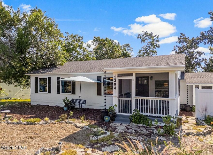 Thoughtfully upgraded and lovingly maintained. Furniture included, this beautiful home at 1304 Buena Vista Boulevard is move in ready and designed for comfort, privacy, and long term peace of mind. Every update reflects careful attention to quality, convenience, and easy maintenance. Major improvements include a fully replaced sewer line from the house to the street with the largest residential grinder and pump system available, updated electrical and plumbing systems including new panel boxes, GFCIs, and water heater pan, and a seven year old roof. The attic features blown in insulation for improved efficiency, and new double pane windows have been installed throughout. Custom storm panels which are simple for one person to install provide extra security and protection. The home's construction upgrades extend to structural details: all additions, including the master suite, screened porch, and spa pool area, were built with Simpson hurricane rated straps and clips from ridge beam to foundation. The property was also professionally treated with Termidor in 2024, offering approximately 25 years of subterranean termite protection, and the foundation remains fully dry and sound. Outdoor living is the highlight here. The home's U shaped layout wraps around a private spa pool designed for both relaxation and fun. Steps away, you'll find a large gazebo, fire pit area, tree swing, 8' x 24' kennel, and vegetable garden with thornless blackberries, asparagus, and a Meyer lemon tree for fresh seasonal produce. The 6' privacy fence surrounds the backyard, while the front yard and curved walkway maintain a warm, welcoming curb appeal. Designed with comfort and security in mind, this is an ideal home for anyone seeking a balance of functionality, low maintenance, and charming outdoor spaces. It's a truly cared for property waiting for its next owner to enjoy the quality and thoughtfulness built into every detail.