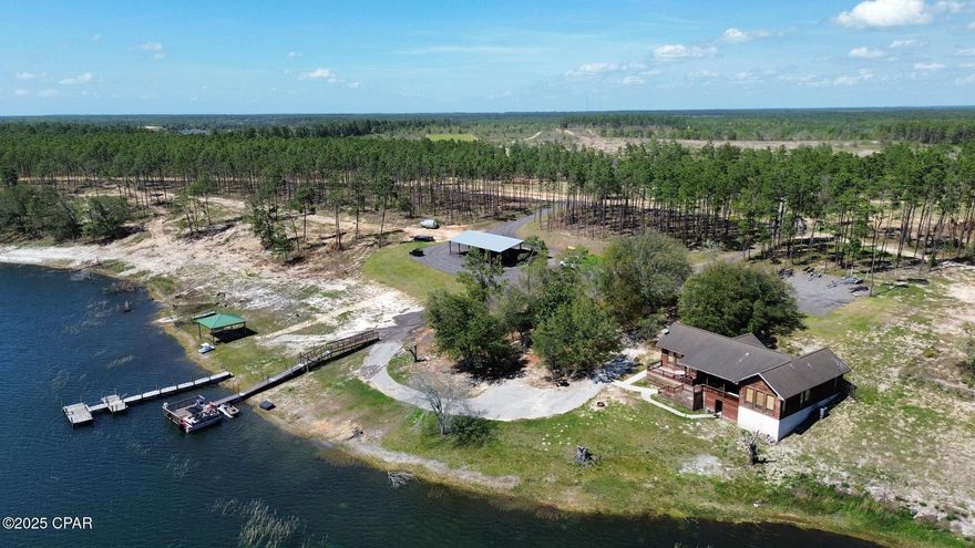 +/-170 acres In Southport, FL with a 60 acre
spring fed pond. 1,773sf - 2bd/2ba house.
Numerous other improvements including multiple docks, 3,000sf pole barn, and extensive road system. Located 1.5 miles from Highway 77 and 30 minutes from the beaches of Panama City. Subdividable.