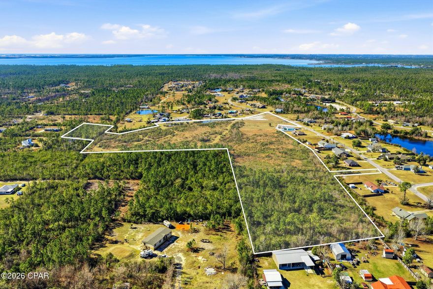 Prime Development Opportunity Near Tyndall Air Force Base!

Exceptional opportunity to acquire approximately 21 acres consisting of nine parcels in a serene and highly desirable Sandy Creek Country Club setting. Enjoy a peaceful, nature-filled environment with abundant wildlife, while remaining conveniently located just 11 miles from shopping, dining, and everyday amenities.

This offering includes extensive pre-development groundwork already completed, providing significant value and time savings for the next owner. Available for review are a survey, feasibility study, drainage engineer report, and site development plan for a single family home. Great information available, positioning this property for streamlined future development. Parcels included in the sale:
07399-329-001
07399-329-000
07399-330-001
07399-330-000
07400-308-010
07400-898-010
07400-898-003
07400-898-040
07399-942-000

A title search is currently being completed to determine whether any parcels are subject to HOA governance or fees. Seller is not currently aware of any active HOA fees. Seller has been previously advised that, if developed, a one-time fee of approximately $900 per home may apply, with annual HOA dues potentially beginning upon sale. Buyer to verify all HOA information, development requirements, zoning, utilities, and intended use.

This is a rare opportunity to invest in a thoughtfully prepared development site with strong location fundamentals, and natural surroundings.