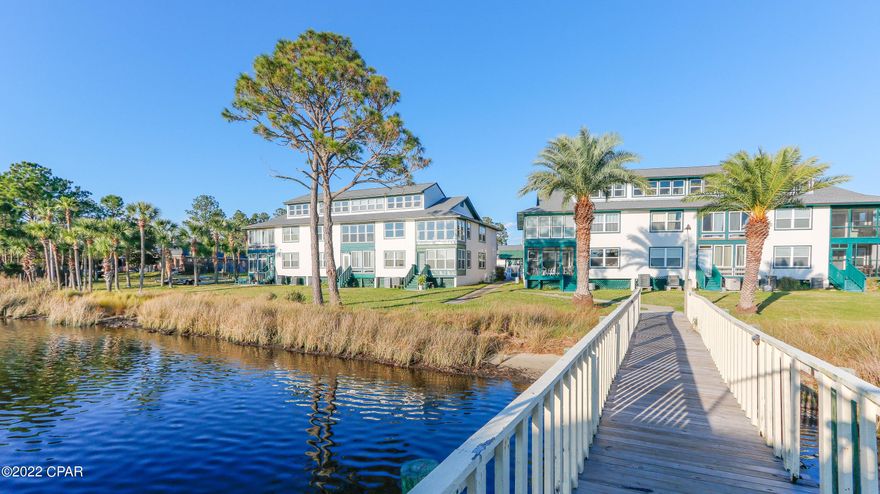 CURRENTLY UNDER CONTRACT - SELLER STILL ACCEPTING BACK UP OFFERS. Attention Cash Buyers This is an excellent Investment opportunity close to Naval Coastal Systems Station on Thomas Dr. This quiet 2nd story 2 bedroom 2 full bath condo located in a waterfront community off of North Lagoon Dr  in Panama City Beach has been mostly renovated, all wood vinyl plank flooring and is bright and cheery..  Appliances work well but could be updated.  This would make a fabulous long term rental or 2nd home.  Close to the Marinas along Thomas Dr and all the restaurants.  Located at the east end of Panama City Beach so also close to the Sugar white sands of Panama City Beach.  Monthly Rentals allowed and long term rentals as well. No Boat Slip with this unit