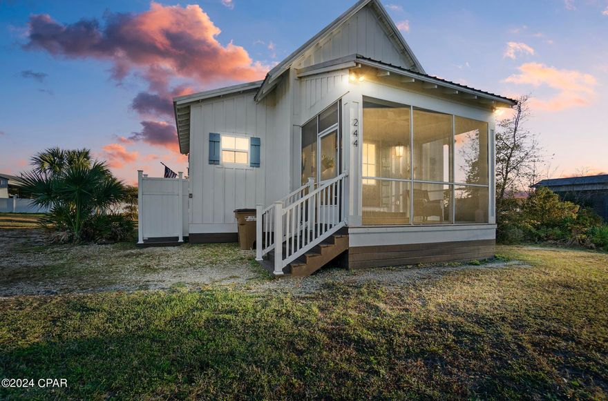 This St Joe Beach, Florida cottage is a block and a half from the beautiful white sandy beaches of the Gulf of Mexico. The cottage includes one bedroom but maximized space by adding private built-in bunk beds to support space for the whole family. Don't forget that Gulf County beaches are pet friendly! Enjoy a private outdoor shower area perfect for cleaning up after a long day at the beach. The covered patio area includes a ceiling fan and unique lighting to enjoy while cooking on the permanent outdoor grill. This is the perfect income-producing rental or retirement home for a fellow animal lover. The cottage also comes fully furnished! Because the property is not in an HOA area, there are no restrictions on parking your fishing boat, and plenty of space here to do so. Currently, the home is listed on the short-term rental market and has been lucrative for the 2023 season, which was their first year on the market.