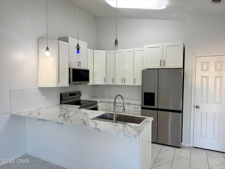 This 1 bedroom 1 bath duplex is located off Thomas Drive. Nice size living room, kitchen with breakfast bar. Bedroom has sliding door to patio and mostly privacy fenced back yard. Approximately 800 square feet of living area. Just a short walk to the beach or the fishing dock on Grand Lagoon. Pets are negotiable. To see this property Please text a photo of your driver's license to our office number ending in 1673,  along with the name of the property that you are interested in and we will schedule your showing within 1 business day.  We apologize for  being cryptic about our phone number, it is likely on the web page you are viewing, but our MLS rules make this procedure LESS THAN 'user-friendly'.  Please do not fill out an application on any website until we send you the invite AFTER your showing.  Thank you.