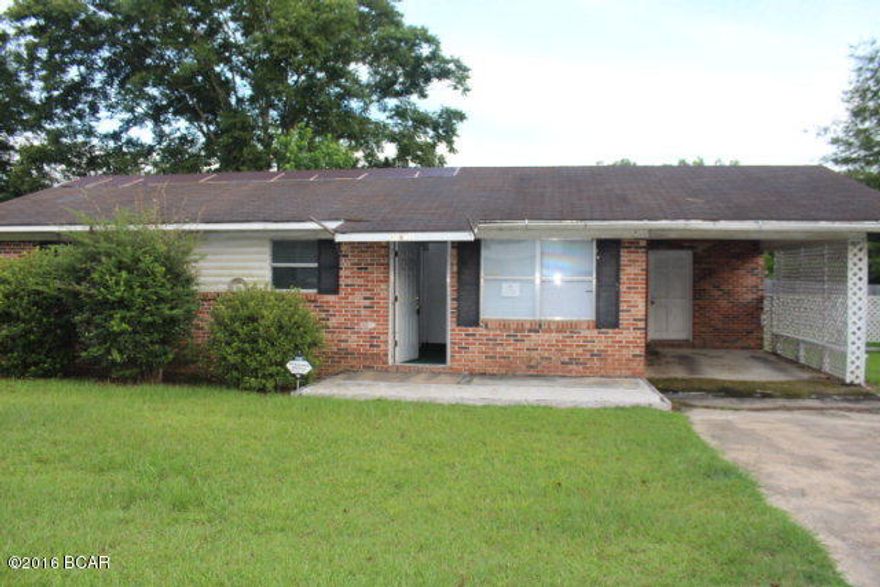 Here is your chance to be a home owner! This brick house is in town in a very convenient location and has so much potential! It has a nice yard and is partially fenced. The home needs some attention so bring your tools and make her yours! It has a formal living room, a large kitchen/dining room and an attached carport.