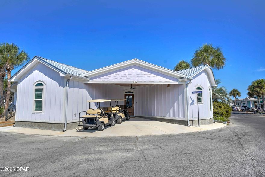 Step into your dream coastal getaway! This gorgeous new 3-bedroom, 2-bath home is perfectly positioned on a corner lot and combines fresh, modern design with the relaxed charm of beachside living. From the moment you step through the solid wood front door, you'll be greeted by bright shiplap walls, elegant flooring, and an open-concept living area designed for effortless entertaining. The living room has vaulted ceilings with exposed wood beams and stylish modern ceiling fan.  
The chef-inspired kitchen features:
Custom white cabinetry with crown molding and soft-close drawers,
sleek quartz countertops, designer tile backsplash, and stainless-steel appliances. Also, here you will find a bright dining nook with upscale lighting and built-in banquette seating — perfect for gatherings!
The luxurious bathrooms are beautifully appointed with frameless glass shower doors, marble tile, and a built-in bench for added comfort.

Upgrades & Highlights: Durable Hardie Board siding, tankless water heater, impact-resistant windows, stunning plantation shutters throughout and energy-efficient lighting and appliances.

The resort is currently undergoing a beautiful transformation, with newly paved roads throughout the community giving it a fresh, updated look. 

Whether you're looking for a primary residence, second home, or a potential powerhouse investment property, this home offers it all. Located in the highly sought-after Venture Out Resort, a vibrant golf cart community featuring 300 feet of private Gulf-front beach and 1,000 feet on Grand Lagoon. Residents enjoy two pools, a fishing pier, boat ramp, mini golf, and more!

Come live your best life in paradise—this coastal gem won't last long!