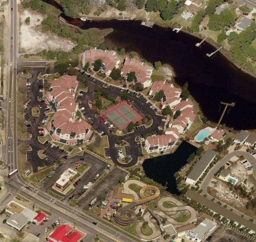 Great opportunity to live a block from the beach and will make a great rental or 2nd home at this price. Furnished and has been on a long term rental. Needs carpet. Has new water heater. This is one of the few units with a double wide balcony. Best price in complex based on sq. footage. Two tennis courts in the center of the complex, and a wide variety of commercial business' on the ground level of this building. This complex is just across Thomas Dr from the beach with public access. Everything you need is just steps around the complex, Go carts, mini golf, arcade, Wendy's and Mexican food.!