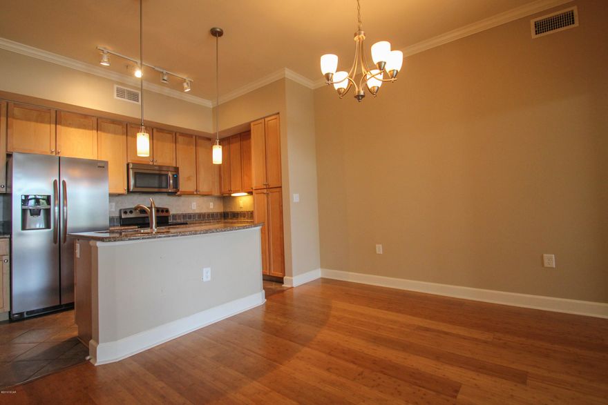Unit is being sold as an investment with long term renter already in place. Great unit with a private location. 5 Star Resort living with 1 acre pool, fitness center, indoor basketball court, and theater with no vacation renters allowed keeps Island Reserve the most sought after community in PCB. This 2 bedroom 2.5 bath condo is located in Bay County’s nicest gated community for condo living only 1 mile to the Gulf of Mexico where you can walk in the sugar white sands along the World's Most Beautiful Beaches. There is beautiful Bamboo flooring in the open concept living and dining room areas which flows into the kitchen. Granite countertops and a large island make this kitchen perfect for entertaining friends and family. The layout of this condo has 2 Master suites,