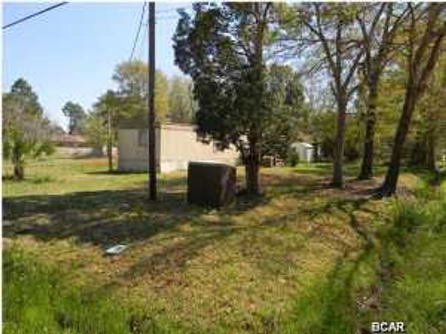 SOUTHPORT - CLEARED CORNER LOT WITH SINGLE WIDE AND SHED. The property comes with electric, well, public water and septic. You can see the bay from the road. Zoned R-2 (Residential Single Family, Duplex or Manufactured Home). School Zone: Southport (K-5) and Deane Bozeman (6-12). You can temporarily live in the mobile home while you are drafting your future home's blueprints OR saving up to build. If you don't need it, scrap it. Call today for your own private preview. All information derived from County Departments and property appraiser's website; buyer to verify if important.