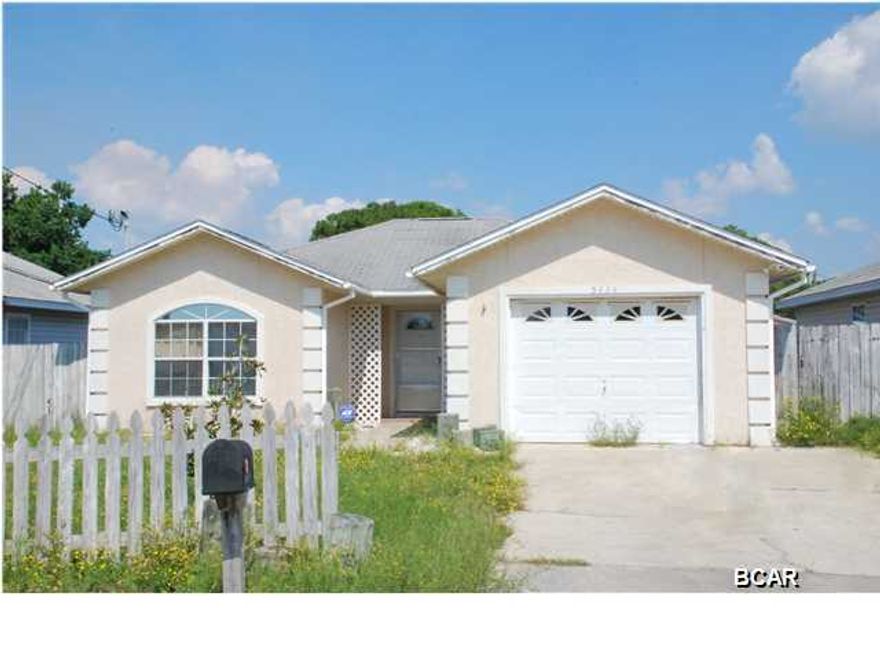 Your beach cottage awaits! Just a few blocks from the world's most beautiful beaches, this two bedroom, two bath beach house is convenient to shopping, restaurants and the Navy base. The floor plan is open and bright with vaulted ceilings. The eat-in kitchen is open to the family room and all appliances are included. There are beautiful bamboo floors in the family room and bedrooms and tile in the kitchen and baths. There is a large screened porch on the back of the home overlooking the deck and fenced back yard. The home also comes furnished but for some personal items, so no need to purchase extra furniture! The home has a single-car garage and a security system as well. Come buy your little piece of paradise!