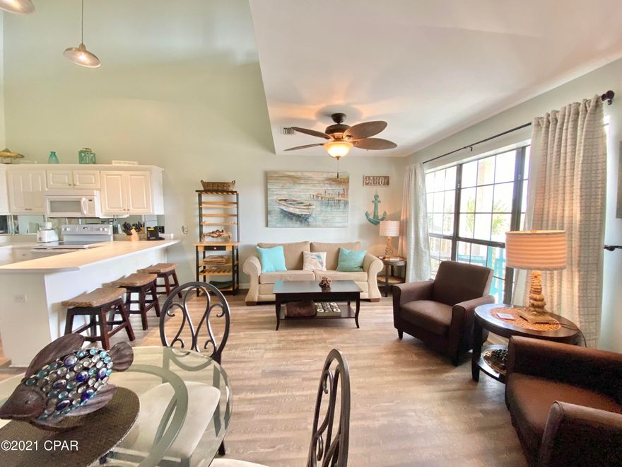 CURRENTLY UNDER CONTRACT, SELLER ACCEPTING BACKUP OFFERS-With Gulf Views from the Bedroom Loft-This 2BR / 1.5BA at Horizon South offers a spacious floorplan with many upgrades including newer appliances; new LVP flooring; and new Water heater in August 2021.  This unit is located just steps to the community pool and one of the closest units to the beach. Horizon South amenities include gated access, three community pools, hot tubs, tennis court, shuffleboard, and fitness facility.  New Water Heater in August 2021.