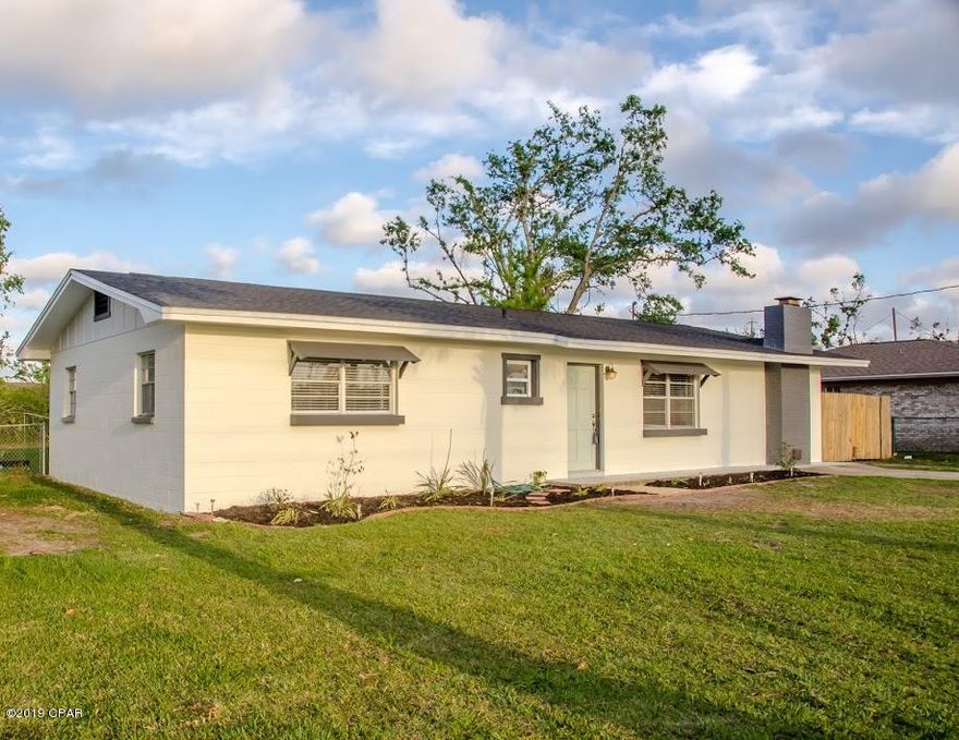 FULLY RENOVATED HOME WITH WATERVIEW! It will be hard to find a better location, this home is located directly across from the boat launch in Lynn Haven! Enjoy kayaking, fishing, the park or swimming at the designated beach. When you enter the home you will be greeted with an open floor plan, a large living room with a wood burning fireplace & an updated kitchen. The kitchen showcases granite countertops, stainless steel appliances and beautiful white cabinets. The laundry room is located nearby & is a great size. As you continue your way down the hall you will find the renovated spare bathroom with a tile shower, new lighting & new tile flooring. Next you will notice the spare bedroom which is conveniently located next to the spare bathroom. The master bedroom is across the hall & has.. beautiful water views. The masterbathrom features an updated tile shower and new lighting. As you make your way outside of the home you will be impressed with the huge fully fenced backyard with a storage shed. The home has a new roof, has been freshly painted, new flooring, new lighting, etc. Only steps away from boat launch, small beach area & park! All ages, sizes, and specifications are estimated and must be verified.