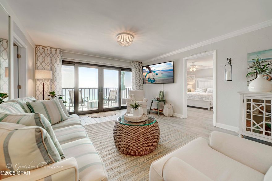 Experience the ultimate in coastal living with this beautifully updated condo in the heart of Panama City Beach, Florida. Elegance meets coastal sophistication in this exquisite three-bedroom, three-bath, gulf-front condominium located at The Commodore. Upon stepping inside, you are greeted by the beautiful porcelain wood plank tile floors leading into the main living area. The open kitchen complete with pantry includes updated stainless appliances, granite countertops, and it's open to the living area, with views that flow seamlessly onto the balcony thanks to fully retracting glass doors. This must-see property features a bright open floor plan with an accent wall adding a touch of interest to this sophisticated space. Wake up to breath taking views in the spacious, lockout primary suite with direct access to the Gulf front balcony, an ensuite with twin vanities, and a beautifully updated walk-in shower. There is a second primary ensuite, featuring a single vanity, shower tub combo, walk in closet, also with access to the Gulf Front balcony for guests to enjoy. The third bedroom enjoys views of the bay, has a walk in closet, and direct access to the third bathroom. Enjoy the sunrise and sunset over the tranquil, green waters from the expansive balcony that extends forty-one feet across the front of your unit. Updates in 2019 include: Tile flooring throughout, bathrooms, interior paint, appliances, bathrooms, HVAC, hot water heater, and furnishings. The property is being sold mostly furnished, including hurricane shutters for all three balcony doors and the two windows on the North side, which may assist with insurance costs. There is also a dedicated storage closet just outside the unit for your beach toys. The property is perfectly located on the quiet East end of Panama City Beach, close to St. Andrews State Park, local marinas, restaurants, and shopping. 
The Commodore has both spectacular coastal views and excellent amenities which include a private boardwalk with direct access to the beach, large Gulf side seasonally heated pool, hot tub, basketball court, shuffleboard court, pavilion with picnic area and grills, onsite rental management company, and you will feel secure with the gated access and 24 hour security. The HOA fee covers water, sewer, trash, cable, and internet, ensuring you enjoy a hassle-free living experience. 
This meticulously maintained condominium, never rented, presents a unique opportunity to acquire your personal piece of paradise. Please schedule your private viewing today! While all information is deemed accurate, buyers should verify details if they are of importance.