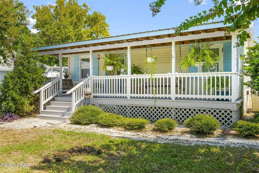 Welcome to your new beach cottage or short-term rental investment property on the desirable west end of Panama City Beach and Seller has an assumable VA loan on the property at 2.875% with a balance of $118,911.95 as of 10/06!!!!!!!! offering significant financial benefits for eligible buyers!!!!!    Located on the quiet west side, you can enjoy the beautiful scenery without the heavy traffic. This home offers the best of both worlds with its prime location just a short walk from Lake Powell, the beautiful Gulf of Mexico, and essential amenities.

You'll love the convenience of being close to Publix and local favorites like Bayou Bill's Crab House and Lake Powell. The home is also just a short drive from the popular Pier Park and the scenic Highway 30A.

The interior has been meticulously updated and maintained, featuring granite countertops, newer floors, and a completely remodeled bathroom. The property also features an impressive extra-large gravel driveway (30' x 100') that provides ample space to comfortably accommodate multiple large vehicles, including RVs and boats. The large covered front porch offers a perfect spot to relax on quiet evenings, and the backyard is secured with an 8-foot privacy fence. 

For your storage needs, there is a large, detached, insulated workshop with power that can also be used as a owner's closet. The home was updated in 2015 with a new metal roof, a new HVAC system, new water heater, and windows.

Don't miss this opportunity to own a wonderful beach house in a highly sought-after location. Call Teague today to schedule a showing!