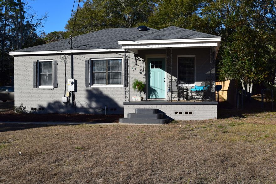 CHARMING FLORIDA COTTAGE located between Lake Caroline, BEACH DRIVE and St ANDREW attractions. This home has been restored and offers the best of both old and new. ORIGINAL HARDWOOD FLOORS and thoughtful details make this home stand out. A new 30 year roof, updated electrical and plumbing make it affordable for budget minded buyers!The interior has been updated with new bathroom vanity and fixtures. The kitchen has newer appliances and wood counter tops that combine modern and vintage! A large CORNER LOT has a  PRIVACY FENCED backyard and offers views of the Bay. NO FLOOD INSURANCE required!