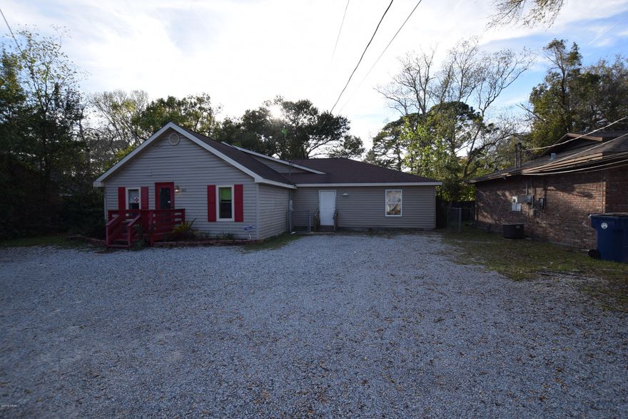 Large commercial space.  Currently used as a day care.  Has kitchen with 3 compartment sink and eating area.  2 Full bathrooms with tub/showers. 3 large rooms that can be used as offices.  Huge open room.  Upstairs has a full bath and 2 rooms.  All rooms on the first floor have a sprinkler system.  This parcel is zoned C1 commercial.  Uses can be office, professional, retail, food service, and more. (Hurricane Damage from Hurricane Michael 10-10-18-Waiting on Ins Report with list of repairs needed)