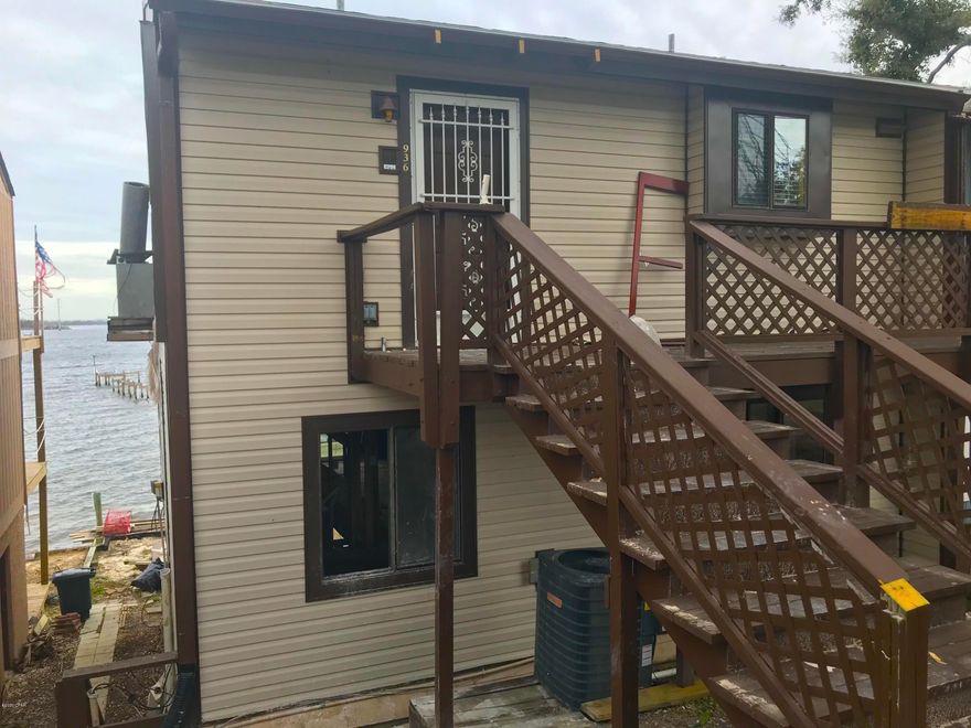 Check out this WATERFRONT (Bay Front) 3-Story townhome in Panama City! Nestled in a great neighborhood this townhome is 2,112 sqft. (heated) and 3,150 sqft. (total). The home has 3 Bedrooms and 2.5 Bathrooms. There is also a paved driveway across the street from your front door which IS part of the property! Although Hurricane Michael damaged this home, a bunch of the remodel is already done! It has a NEW ROOF installed January 2020, and has already been completely gutted and bleach-treated for mold throughout the house. So it is ready for the finished renovation! There's a fireplace and kitchen in the top floor and amazing bay views on all levels. THIS ONE IS A STEAL! IT WILL NOT LAST LONG at this price, so make sure to see it quickly! -----CASH BUYERS ONLY -----