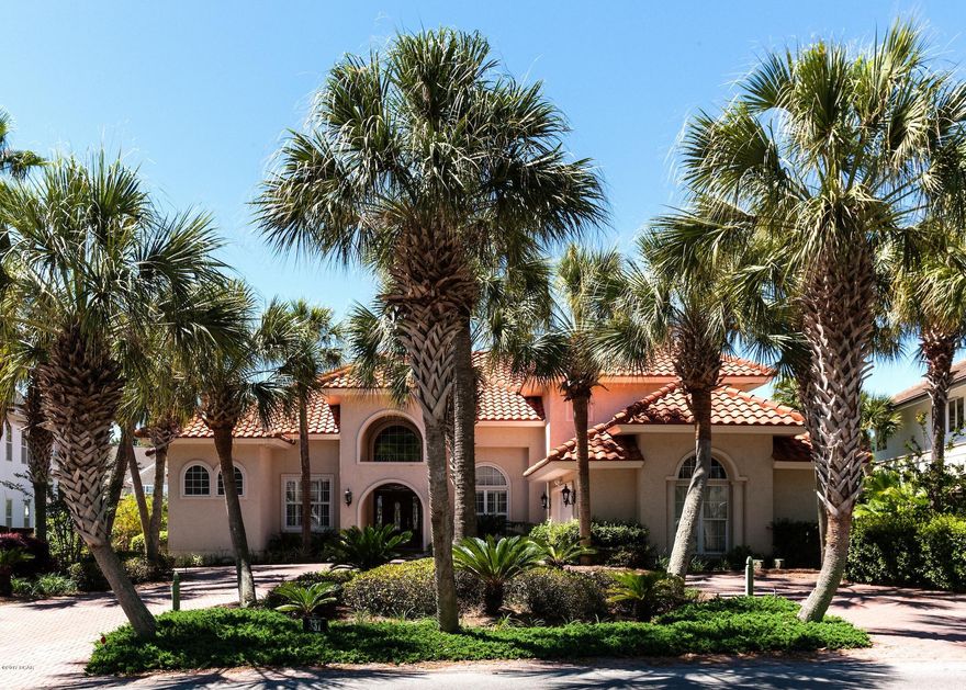 Home is under contract with contingencies. Buyer agreed to allow Seller to accept back up offers. Stunning home in pristine condition on the CANAL in Baypoint! This classy home is perfect for retiree or established family who loves resort style living on the water. Upon entering the home, the foyer, formal living room and dining room are all open, separated by beautiful columns with 10 & 12ft tray ceilings and 14 foot domed ceiling with beautiful decorative crown moulding and large gorgeous decorative limestone tile.  There is a separate study/library with built in bookcase and tv with fireplace and wood floors. The 1st floor master suite is canal front featuring 10 & 12ft decorative tray ceilings, built in tv with lush carpet. The attached master en suite' which features 2 separate his/hers closets, one being a large walk-in closet, has two separate vanities, one being large with dressing table, large decorative mirrors, a separate toilet room and walk-in shower, large whirlpool garden tub with built in TV, linen closet, medicine cabinets and beautiful tile floors. The kitchen is open to the breakfast and den area with 14ft ceilings that open to the 2nd level. This area is canal front and features are granite counter tops, custom stained cabinets, stainless appliances, pantry, bar and access to the back patio overlooking the canal.  There is a built in electric fireplace in the den area and a beautiful staircase leading to the 2nd level. A 2nd bedroom with attached full bath and walk in closet, large laundry area with storage cabinets and sink, a full (pool) bath with shower that has access to the back patio completes the first level.  The second level has a cat walk that overlooks the den area and features 2 additional bedrooms and large full bathroom with garden tub.  The AC was replaced in 2015 and the 105ft dock on the deep water canal is in excellent condition with lighting, electricity, water and sufficient for a large boat. Extra features in this home are an over sized 2 car garage, with access to the attic space above with plywood floors for extra storage, security system, wired for surround sound, built in TV's in all but 1 bedroom, decorative crown moulding throughout, walk in closets and 9ft ceilings in 3 bedrooms, beautiful large limestone tile in all common areas, large mahogany stained glass front door, no grass to maintain, irrigation system, circular brick pavered driveway with plenty of parking, lush landscaping with 36 beautiful tall palm trees on property, brick pavers in the rear of the home, double paned windows with hurricane shutters for the back/south facing windows, concrete tiled roof, 30 year dock wall not to mention being located in the most desirable golfing neighborhood in PCB where everyone loves to gather and meet friends at the yacht club, restaurants or marina overlooking St Andrews Bay. There is plenty of room for a pool if desired. This home must been seen to appreciate the quality.  Buyers must be pre-qualified before scheduling a showing appointment.  See documents for lender recommendations and other info.  Buyer should verify all data and dimensions. Check out the 3-D walk through tour on this listing under photos.  Call me today to schedule your private tour!