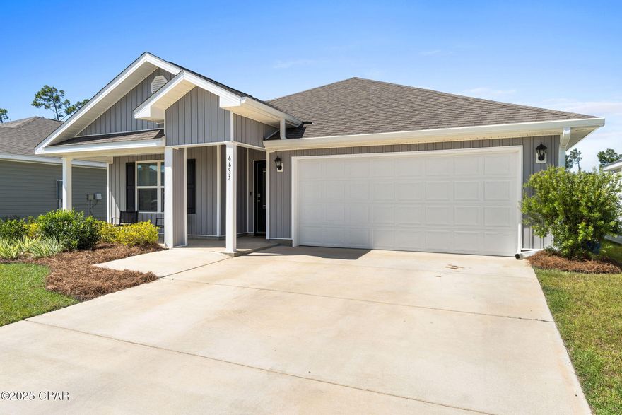 Why Wait to Build When You Can Have Almost New Today! This beautifully designed 4-bedroom, 2-bathroom home in the sought-after Liberty community. With 1800 square feet of living space, this home offers an open and functional layout that blends comfort with style. Step inside to find a spacious open floor plan featuring natural light and bright paint that add to the home's airy feel. The gourmet kitchen is a standout, complete with a large center island, hard-surface countertops with breakfast bar, stainless steel appliances, and plenty of counter space—perfect for cooking and entertaining. The kitchen flows seamlessly into the dining and living areas, making it ideal for gatherings and everyday living. The Master suite offers a peaceful retreat with an en-suite bath that includes dual sinks and a large walk-in closet with direct access to the laundry room. The split-bedroom layout ensures privacy, with LVP flooring throughout the main living areas and cozy carpet in all bedrooms. Outside, enjoy a spacious backyard with the added bonus of being in close proximity to a serene water feature including native deer sightings. The partially-fencing gives you both privacy and room to relax or play. Community amenities include a pool, cabana, playground, and green space. Located just minutes from shopping, grocery stores, the World's most beautiful beaches and Tyndall AFB this home combines modern living with everyday convenience. 

Don't miss the chance to make it yours!