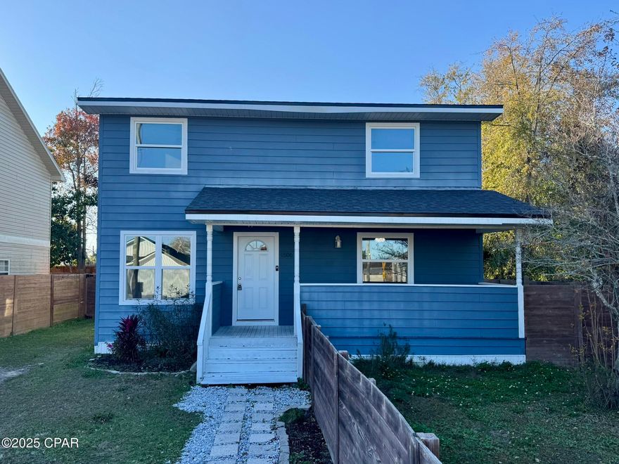 This home has everything you are looking for Conveniently located off  Hwy 77 and 390 in Lynn Haven! Freshly Painted, Three bedrooms, 2 bathrooms upstairs, 1 bedroom + half bath downstairs, updated kitchen, HUGE sunroom with a bonus frig (plus ice), very nice outdoor entertainment area with deck and firepit, LARGE fenced yard.