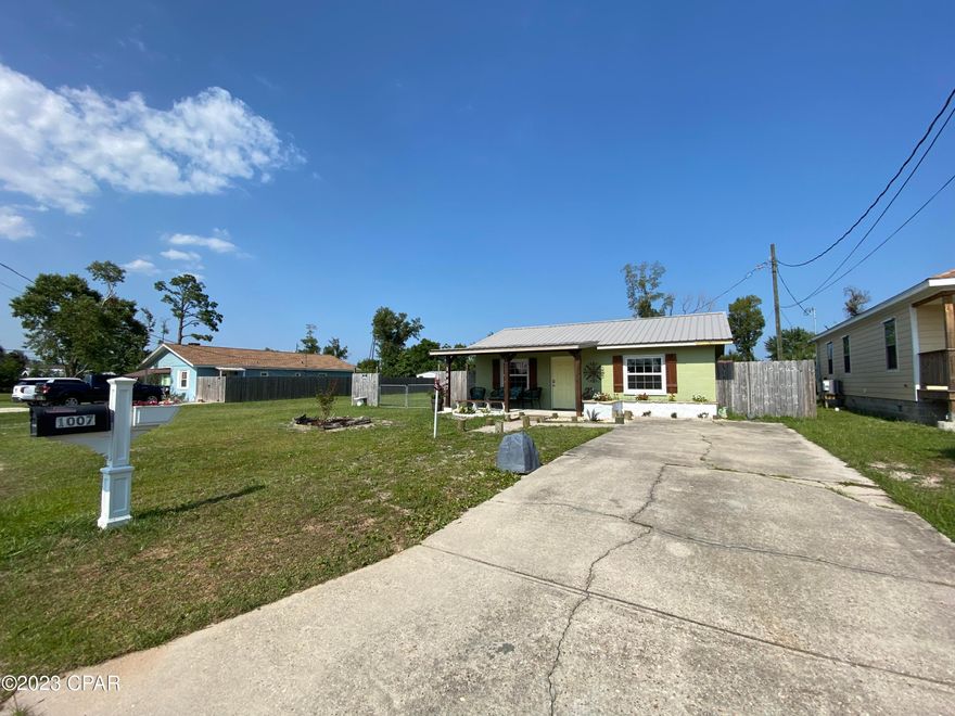 CURRENTLY UNDER CONTRACT, SELLER WILL CONSIDER BACKUP OFFERS - Cute as a bug in a rug.  This home is centrally located in Lynn Haven on oversized double lot.  The 1/3 acre lot has 25x40 shed with two garage doors and 110amp power service.  There is also an RV hookup with water, sewage and 30amp power service.  The home was recently remodeled in 2019 with new metal roof, new windows, new electrical, new plumbing, new 8x15 covered front porch, new hardiboard siding and fresh exterior paint. The kitchen was remodeled with new hickory cabinets, new stainless steel appliances and granite countertops.  The bathroom was updated with new vanity, new fixtures and tiled shower.  There is also a 20x20 area that has been wired and plumbed for an additional bedroom and bathroom to be easily added  Other upgrades include new crown molding, new baseboards, new water heater and shiplap accents throughout the house.  There is a large covered lanai for entertaining.  Home comes with transferable home warranty paid through 2026.  Call to see today!