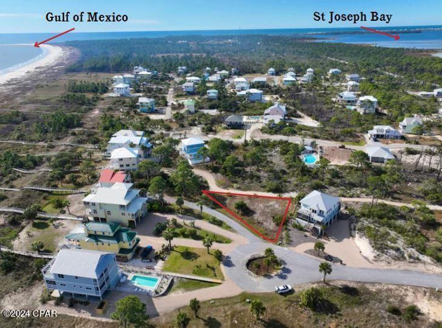 IMPRESSIVE 1ST TIER LOT W/GULF VIEWS ON THE S CAPE IN THE GATED COMMUNITY OF SOUTH BEACH! Build your dream home in a quiet setting just steps to uncrowded, pet friendly beaches. Amenities include deeded beach access, dedicated dock & underground utilities. Fish from the shoreline or take a bike ride down miles of paved nature trails. Enjoy nearby family friendly Salinas Park for kayaking, horseback riding & pickleball courts or visit locally owned businesses & restaurants for fresh seafood, native cuisine & live entertainment. If you're looking for an investment, this area offers proven rental income throughout the year. A recent survey is available for you to start making your design plans right away. Fall in love w/the Forgotten Coast and start living the beach life! Call for a showing & tour of the area today!